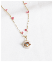 Collar ojo rosa y nacar