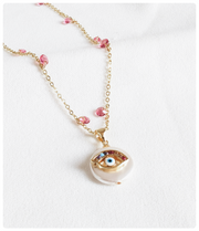 Collar ojo rosa y nacar